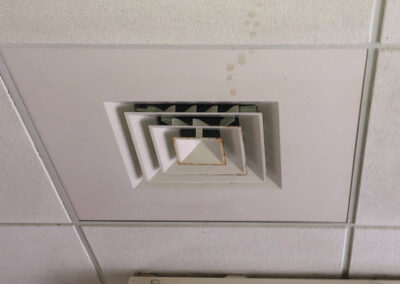 A vent cover and ceiling tiles have been thoroughly cleaned by American Clean Air.