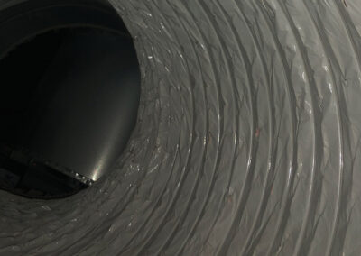 Clean, bright air duct interior with no visible dirt or dust, revealing a smooth, clear surface.