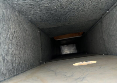 After image displaying a clean, clear dryer vent with all lint and dust removed for improved airflow.